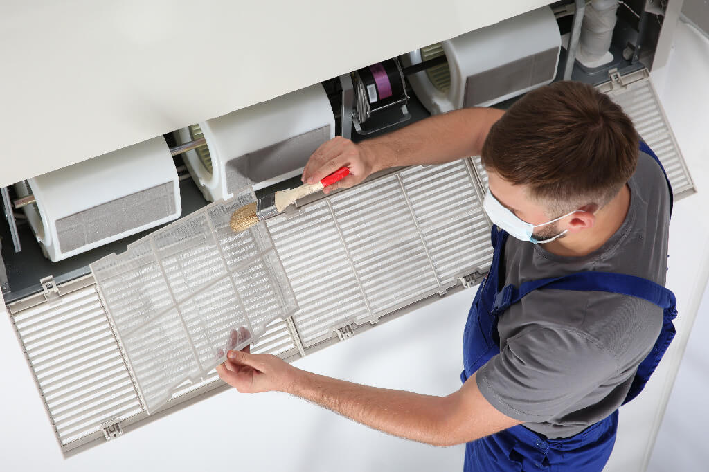 Repair-Technicial-Replacing-Air-Filter—When-to-Change-Commercial-Air-and-Water-Filters-in-Your-Foodservice-Facility (1)
